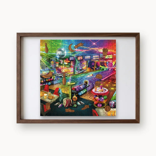 Cosmic Bowling Alley, a rectangular whimsy-cut wooden puzzle shown framed as wall art